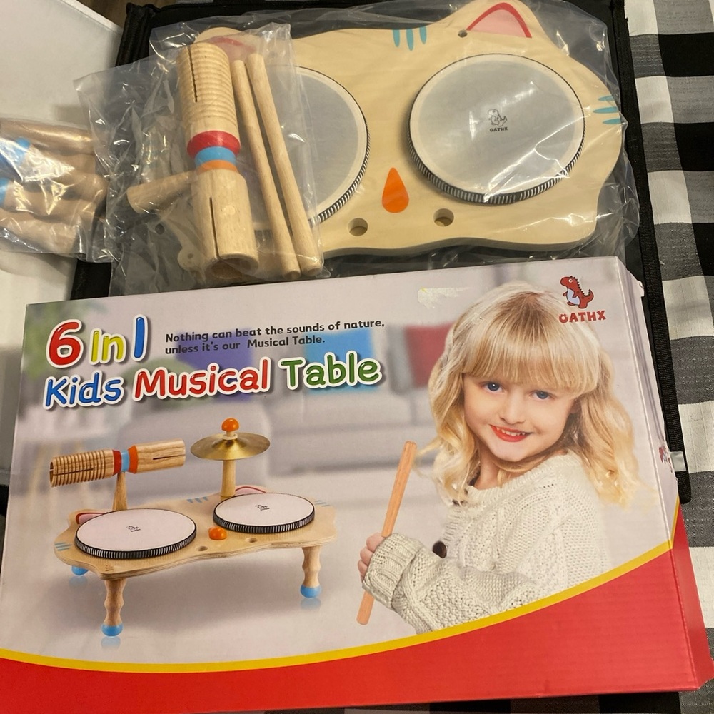 Cream and Red Learning Toys Musical Instrument Set 6-1 table